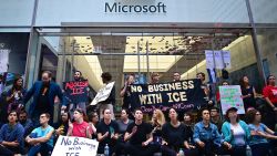 Protestors block the entrance of a Microsoft store in midtown Manhattan during a rally against the US immigration policy on September 14, 2019 in New York City. Some dozens protesters were arrested by the police after blocking the 5th Avenue.