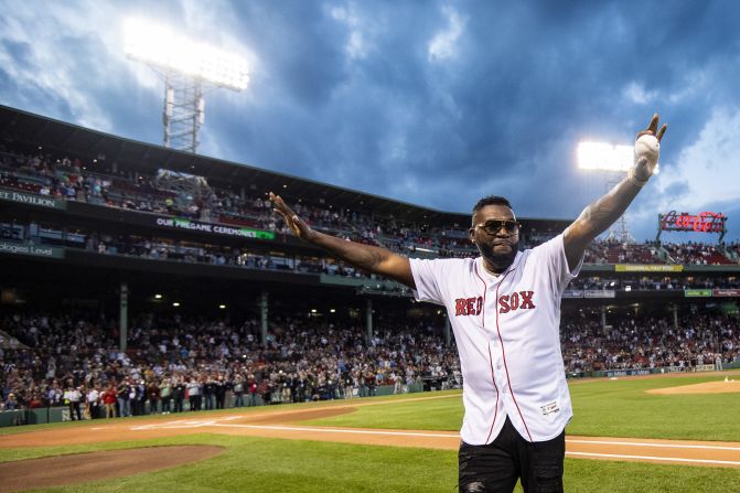 Former Boston Red Sox star David Ortiz acknowledges the crowd before throwing the first pitch at Fenway Park on Monday, September 9. It was <a href="index.php?page=&url=https%3A%2F%2Fwww.cnn.com%2F2019%2F09%2F09%2Fsport%2Fdavid-ortiz-first-pitch-fenway-park%2Findex.html" target="_blank">his first public appearance</a> since being shot in the Dominican Republic earlier this year.