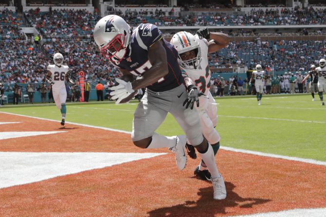 New England wide receiver Antonio Brown catches a touchdown pass during an NFL game against Miami on Sunday, September 15. It was his <a href="index.php?page=&url=https%3A%2F%2Fwww.cnn.com%2F2019%2F09%2F15%2Fus%2Fantonio-brown-sunday-patriots-vs-dolphins%2Findex.html" target="_blank">first game as a Patriot</a>, and it came five days after he was sued on allegations of rape and sexual assault. Brown has denied the allegations.