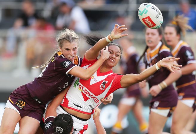 Takilele Katoa, a rugby player for the St. George Illawarra Dragons, gets rid of the ball as she's tackled during a league match in Sydney on Sunday, September 15.