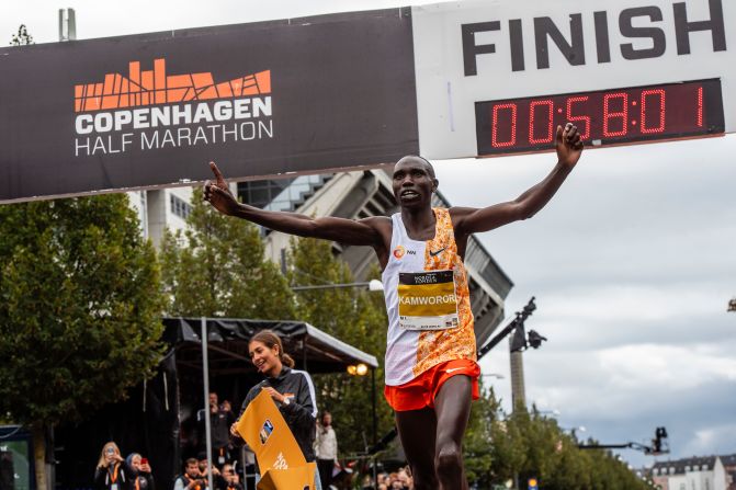Geoffrey Kamworor crosses the finish line after breaking the world record in the half marathon on Sunday, September 15. The Kenyan ran the race in 58 minutes and one second, shaving 17 seconds off the previous record.