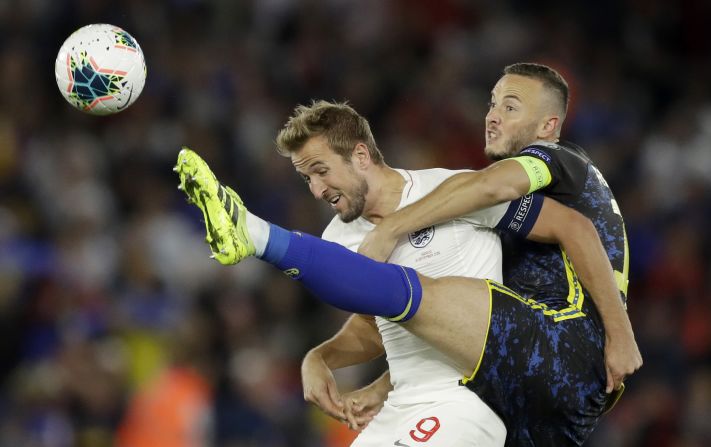 England's Harry Kane, left, tries to shield the ball from Kosovo's Amir Rrahmani during a Euro 2020 qualifier on Tuesday, September 10. England won the match 5-3.