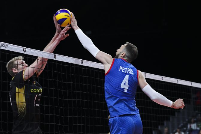 Serbia's Nemanja Petric, right, is met at the net by Germany's Simon Hirsch during a European Volleyball Championship match on Friday, September 13.
