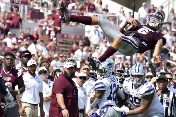 Mississippi State quarterback Garrett Shrader <a href="index.php?page=&url=https%3A%2F%2Fwww.youtube.com%2Fwatch%3Fv%3DXefsZhdmaA0" target="_blank" target="_blank">goes high into the air</a> after being hit by Kansas State players on Saturday, September 14. 