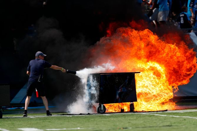 A pyrotechnics machine is extinguished before an NFL game in Nashville, Tennessee, on Sunday, September 15. <a href="index.php?page=&url=http%3A%2F%2Fwww.cnn.com%2F2019%2F09%2F09%2Fsport%2Fgallery%2Fwhat-a-shot-sports-0908%2Findex.html" target="_blank">See 30 sports photos from last week</a>