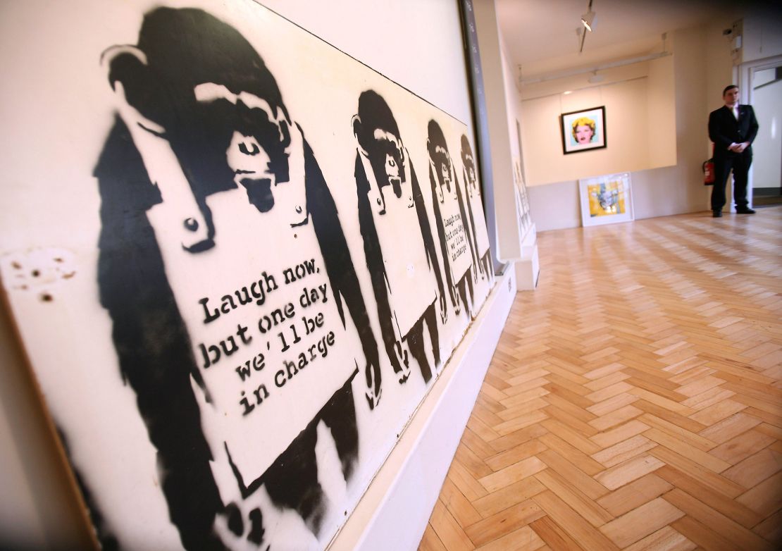 Banksy's 2002 'Laugh Now' is pictured at Bonhams auction house in London on January 22, 2008.  