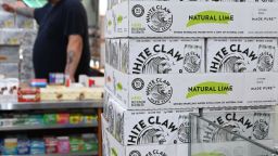 Cartons of White Claw, a flavored alcoholic fizz in a can are on display at the Round The Clock Deli September 11, 2019 in New York City. - Health-conscious American millennials have found their drink of choice: alcoholic carbonated water that is lower in calories and carbs than beer and wine.
A hard seltzer craze is sweeping the United States as Generation Y and Generation Z pursue healthier lifestyles, influenced by viral trends on Instagram and YouTube. (Photo by TIMOTHY A. CLARY / AFP)        (Photo credit should read TIMOTHY A. CLARY/AFP/Getty Images)