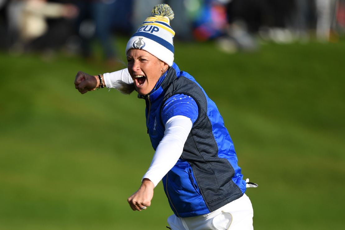 Europe's Suzann Pettersen celebrates after holing the winning putt in the Solheim Cup.