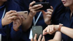 CUPERTINO, CALIFORNIA - SEPTEMBER 10: Attendees look at the new Apple iPhone 11 Pro during a special event on September 10, 2019 in the Steve Jobs Theater on Apple's Cupertino, California campus. Apple unveiled several new products including an iPhone 11, iPhone 11 Pro, Apple Watch Series 5 and seventh-generation iPad.  (Photo by Justin Sullivan/Getty Images)