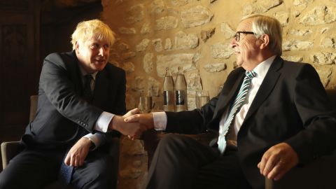 European Commission President Jean-Claude Juncker, right, poses with Boris Johnson before meeting at a restaurant in Luxembourg.