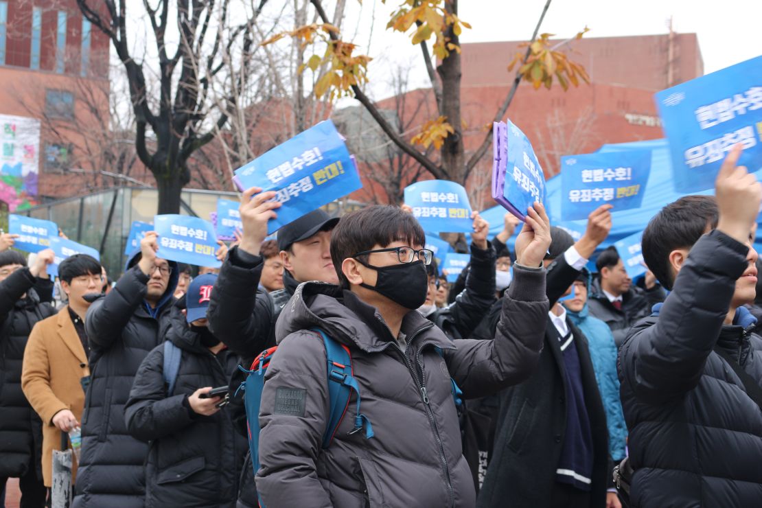 Protesters demand fair trials for men accused of sexual assault at an anti-feminist rally in Seoul, November 2018.