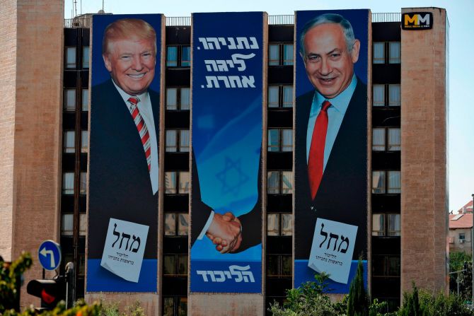 An election banner on a Jerusalem building shows Netanyahu shaking hands with US President Donald Trump. Trump remains <a href="index.php?page=&url=https%3A%2F%2Fwww.cnn.com%2F2019%2F09%2F16%2Fmiddleeast%2Fisrael-netanyahu-trump-intl%2Findex.html" target="_blank">incredibly popular in Israel</a> — far more popular than he is in the United States.