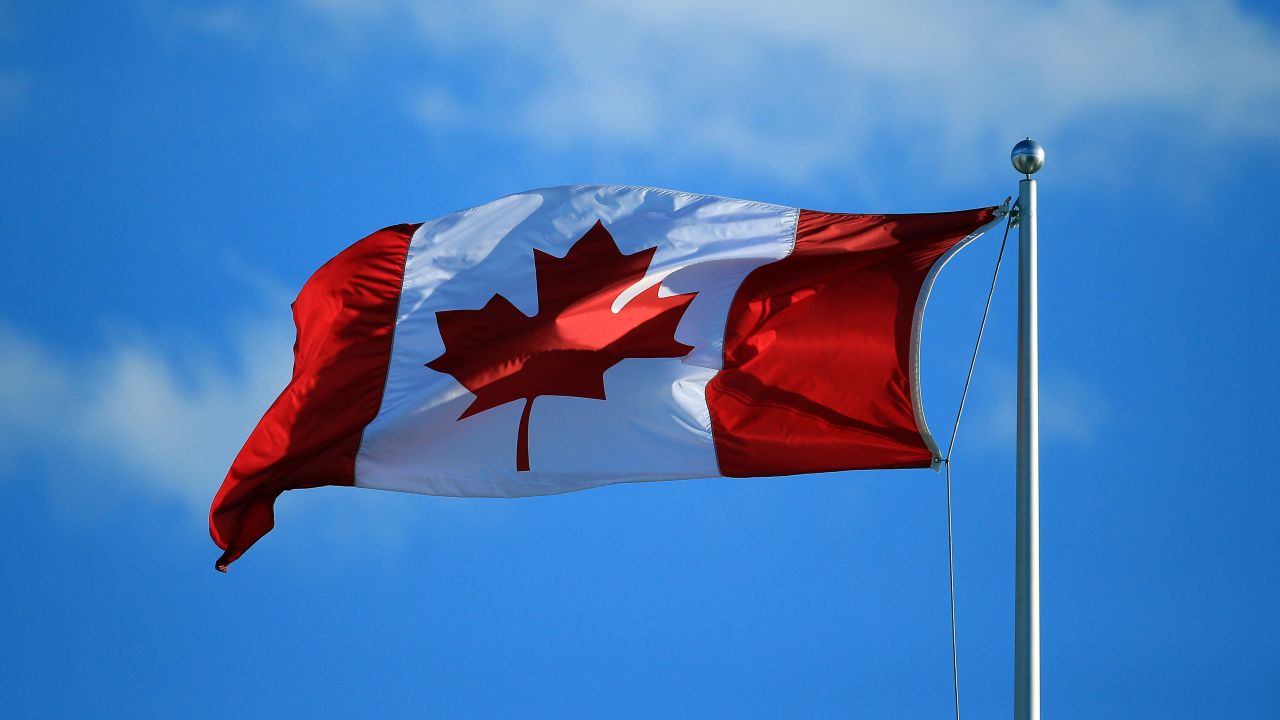 A Canada flag flies in the wind on July 25, 2016, in Toronto, Ontario, Canada.