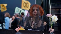 Extinction Rebellion protest at London fashion Week. Protesters from Extinction Rebellion demonstrate outside the BFC Show Space, London. Picture date: Tuesday September 17, 2019. Photo credit should read: Isabel Infantes/PA Wire URN:45330330 (Press Association via AP Images)
