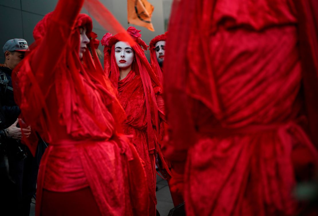 Protesters cloaked in red gathered for an Extinction Rebellion demonstration on Tuesday in London.