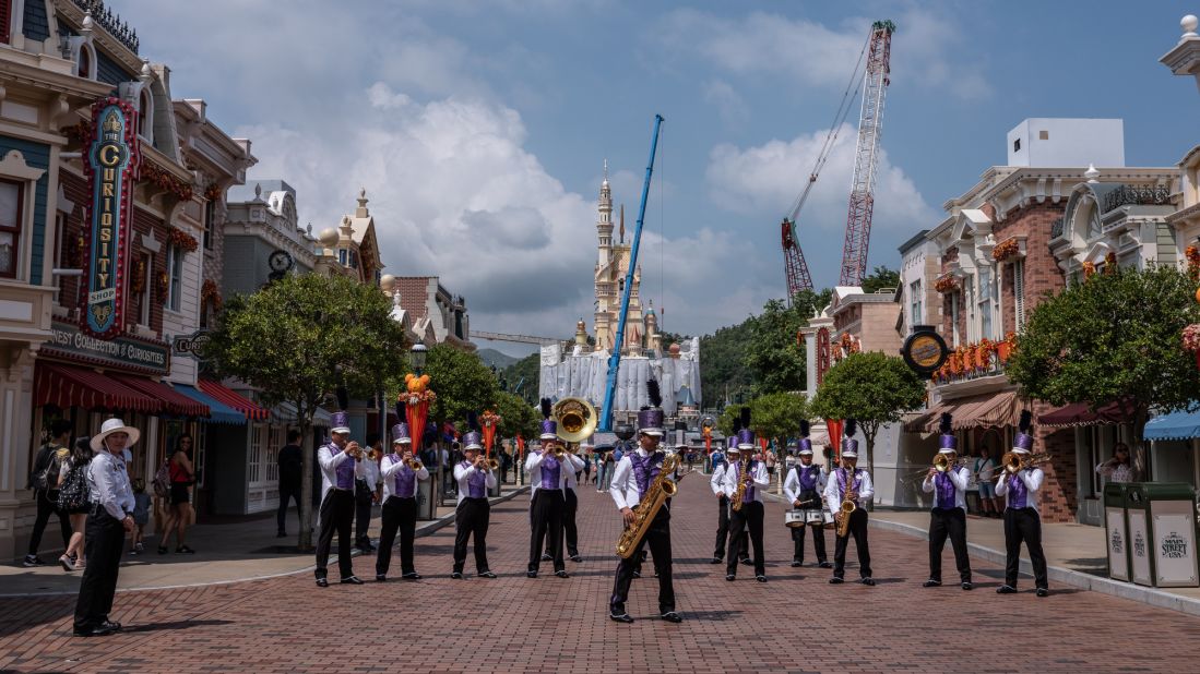 <strong>Hong Kong Disneyland: </strong>A band performs for the small crowds at Hong Kong Disneyland Resort. The ongoing Hong Kong protests have had a negative impact on the city's tourism industry. According to officials, tourist arrivals in August were 40% lower than in 2018. 