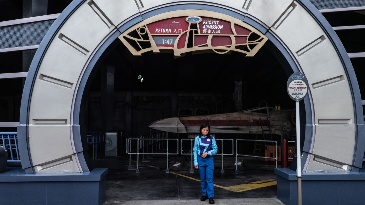 <strong>Hyperspace Mountain:</strong> An employee waits for park guests outside Hyperspace Mountain, which is normally one of the park's busiest rides. 