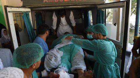 A wounded man is transported in an ambulance at the Wazir Akbar Khan hospital. 