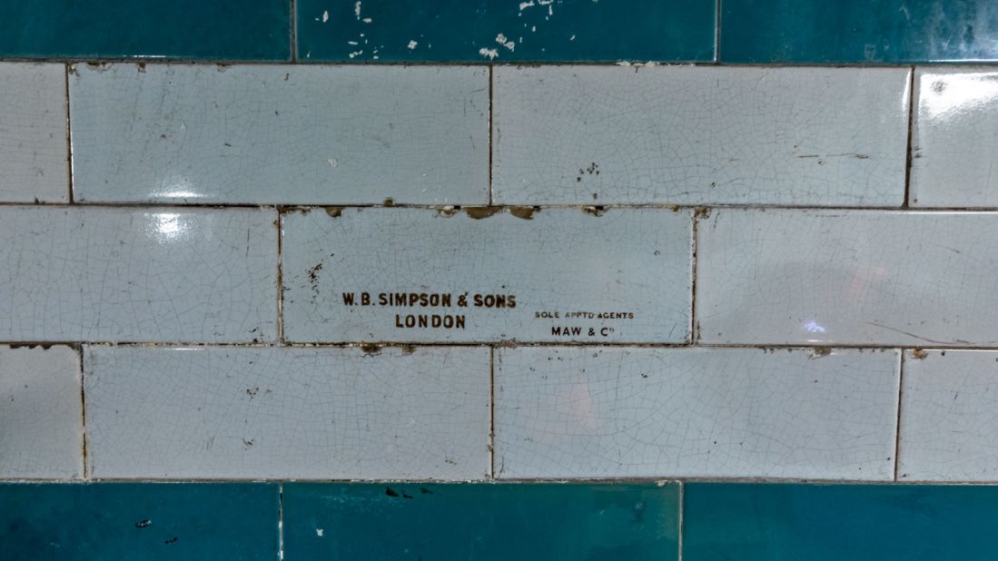 <strong>Intricate details: </strong>This tiled wall in a disused section at Piccadilly Circus station is stamped with the supplier's mark of W.B. Simpson & Sons, London, and made by Maw and Company. 