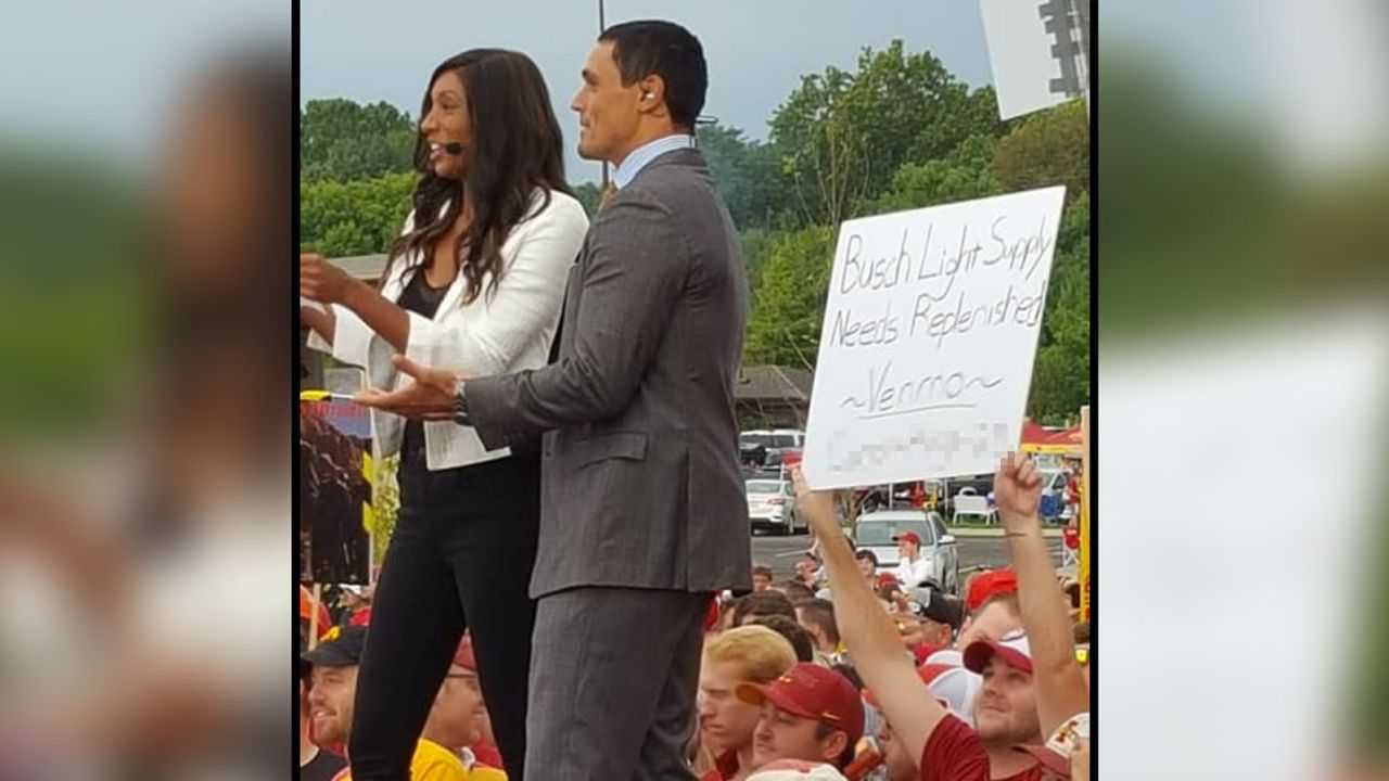 Iowa State fan Carson King holding up a sign asking for beer money at the College Gameday set.
