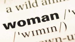 The file photo of the word 'woman' pictured in a dictionary.