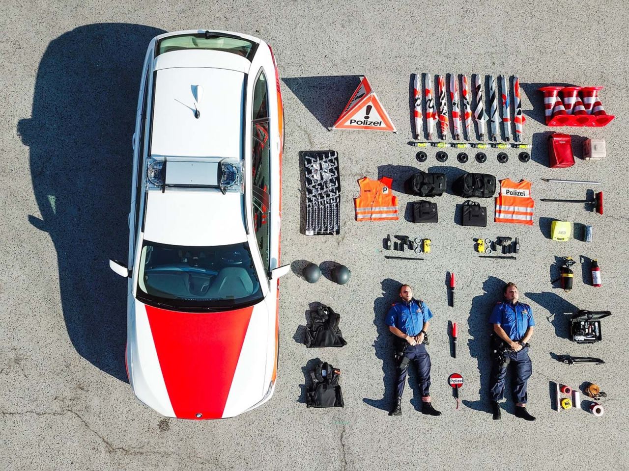 The so-called Tetris Challenge started September 1 when Zurich police published this bird's eye image on social media. It captured two officers on the ground beside the contents of their car laid out in neat, geometric block patterns, like in the popular 1980s video game Tetris. Since then, public services units from around the world have followed suit, photographing their work equipment in rows beside their vehicles. Click through to see more.