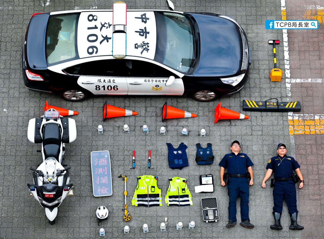Taiwanese police from Taichung City lay out the equipment used to perform their daily public safety services.