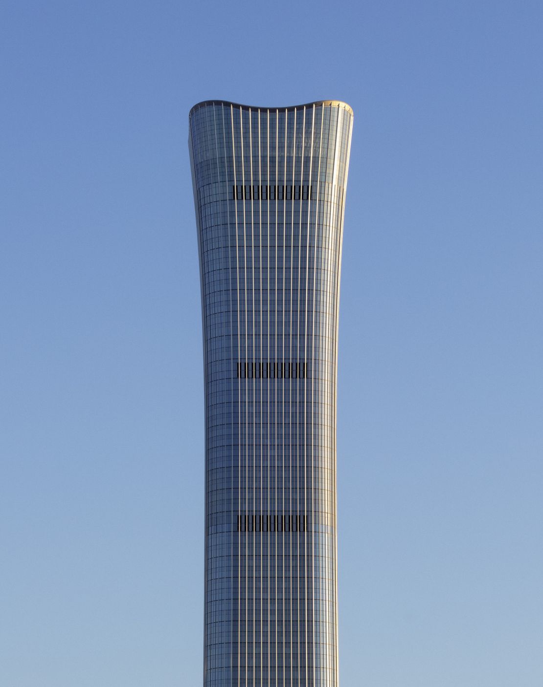 The building's flared top reaches 1,731 feet (528 meters) into the sky. 