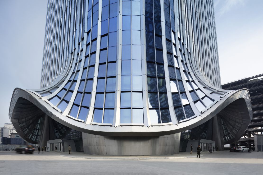 The facade flares out at the bottom, producing a canopy over the pedestrianized space at ground level.