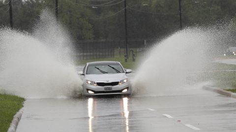 A car navigates floodwaters from Tropical Depression Imelda on Wednesday in Houston.