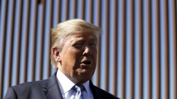 President Donald Trump talks with reporters as he tours a section of the southern border wall, Wednesday, Sept. 18, 2019, in Otay Mesa, Calif. (AP Photo/Evan Vucci)