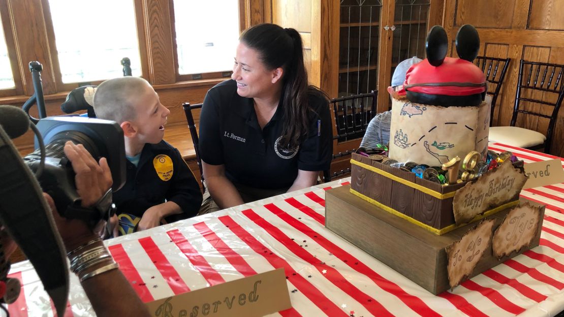 Lt. Brandy Forman volunteers for "Icing Smiles," which provides special cakes to families with ill children. 