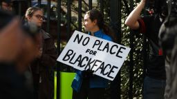 Protestors rally against Virginia Governor Ralph Northam outside of the governors mansion in downtown Richmond, Virginia on February 4, 2019. - Demonstrators are calling for the resignation of Virginia Governor Ralph Northam, after a photo of two people, one dressed as a Klu Klux Klan member and a person in blackface were discovered on his personal page of his college yearbook. Northam said that while he had not appeared in the photo, "many actions that we rightfully recognize as abhorrent today were commonplace" and he was not surprised such material made its way to the yearbook. (Photo by Logan Cyrus / AFP)        (Photo credit should read LOGAN CYRUS/AFP/Getty Images)