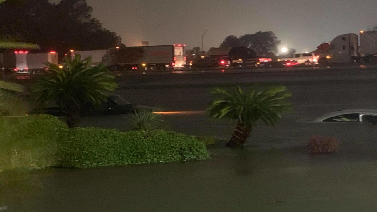 Vehicles were nearly submerged Thursday morning near the Elegante Hotel in Beaumont.