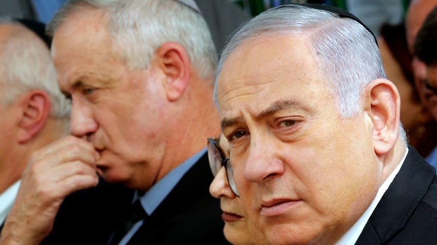 Israeli Prime Minister Benjamin Netanyahu (R), Israeli president of the Supreme Court Esther Hayut (C) and Benny Gantz (L), leader of Blue and White party, attend a memorial ceremony for late Israeli president Shimon Peres, at Mount Herzl in Jerusalem on September 19, 2019. - Netanyahu called on his main challenger Benny Gantz to form a unity government together, a major development after deadlocked election results put his long tenure in office at risk. (Photo by GIL COHEN-MAGEN / AFP)        (Photo credit should read GIL COHEN-MAGEN/AFP/Getty Images)