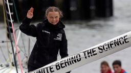 Greta Thunberg waves to crowds waiting for her at the end of a 15-day Atlantic crossing in a zero-carbon yacht.