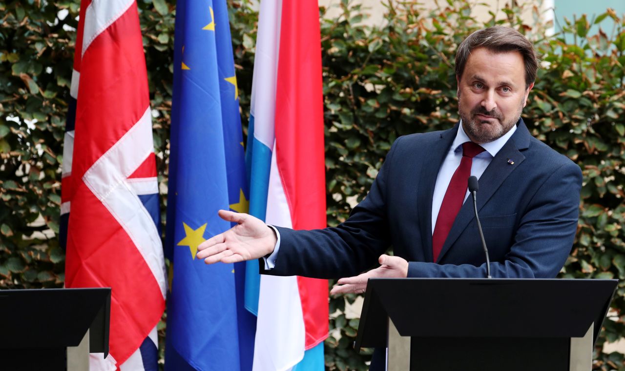 Luxembourg Prime Minister Xavier Bettel gestures at the <a href="https://www.cnn.com/2019/09/16/homepage2/boris-johnson-jean-claude-juncker-brexit-gbr-intl/index.html" target="_blank">vacant podium</a> reserved for British Prime Minister Boris Johnson during a news conference after their meeting in Luxembourg, on Monday, September 16.