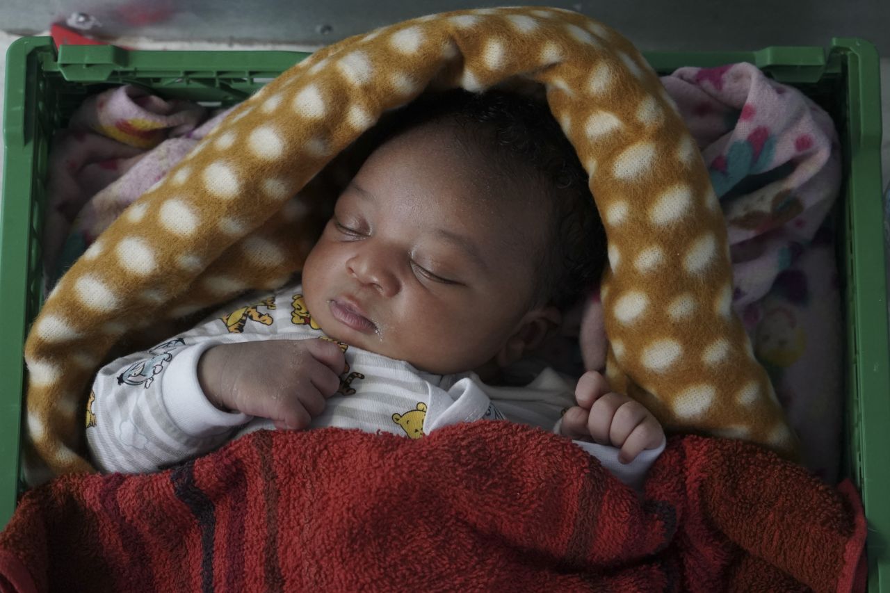 Ange, a 5-day-old newborn baby from Cameroon, sleeps inside the women's shelter of the Ocean Viking humanitarian <a href="https://www.cnn.com/2019/09/14/europe/italy-government-migrant-rescue-ship-intl/index.html" target="_blank">rescue ship</a> in the Mediterranean Sea, on Wednesday, September 18. The baby, his mother and two brothers were among 109 people rescued on Tuesday by the Norwegian-flagged ship operated by SOS Mediterranée and Doctors Without Borders.