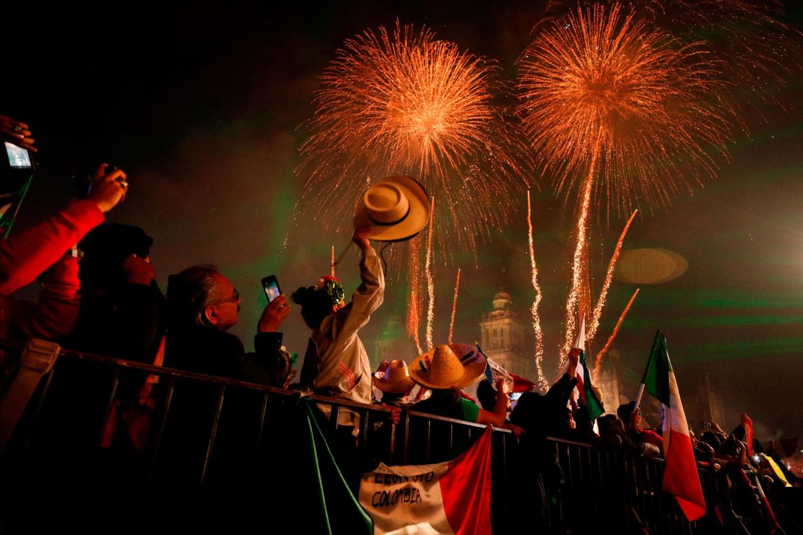 Revelers celebrate as fireworks explode over the Metropolitan Cathedral to kick off Independence Day celebrations in Mexico City, on Sunday, September 15. <a href="https://www.cnn.com/2019/09/12/world/gallery/week-in-photos-0913/index.html" target="_blank">See last week in 27 photos</a>