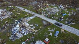 A road cuts through the rubble of homes that belong to the same family, destroyed by Hurricane Dorian in Rocky Creek East End, Grand Bahama, Bahamas, Sunday, Sept. 8, 2019. Bahamians are searching the rubble, salvaging the few heirlooms left intact by the Category 5 storm. (AP Photo/Ramon Espinosa)