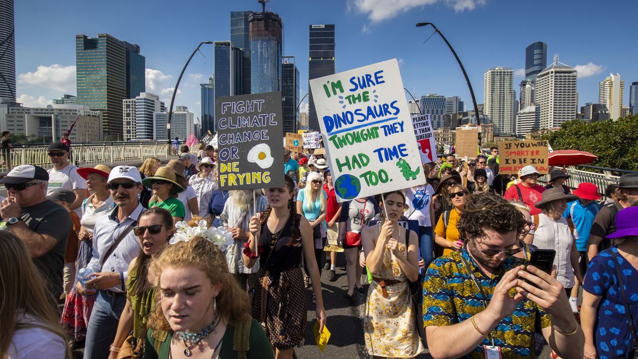 Climate protestors pictured at a rally in Brisbane.