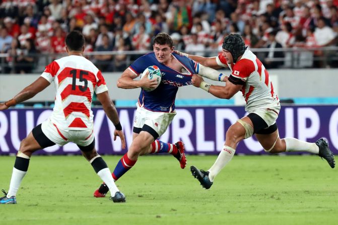 The Rugby World Cup got underway on September 20 as host Japan played Russia in the tournament's opening match. Russia's Nikita Vavilin is tackled by Japan's Pieter Labuschagne.