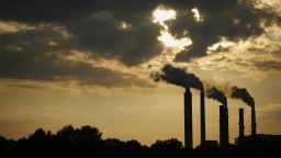 The silhouettes of emissions are seen rising from stacks of the Duke Energy Corp. Gibson Station power plant at dusk in Owensville, Indiana, U.S., on Thursday, July 23, 2015. Coal reclaimed its ranking as the top fuel for generating electricity at U.S. power plants in May, beating natural gas, which took the number one spot for the first time in April. Photographer: Luke Sharrett/Bloomberg via Getty Images