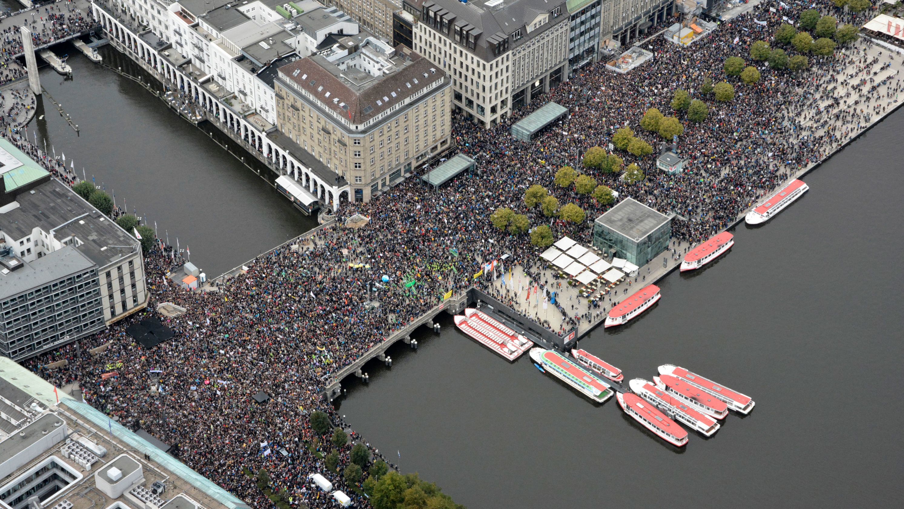Demonstrators fill the Jungfernstieg, a promenade in Hamburg, Germany.