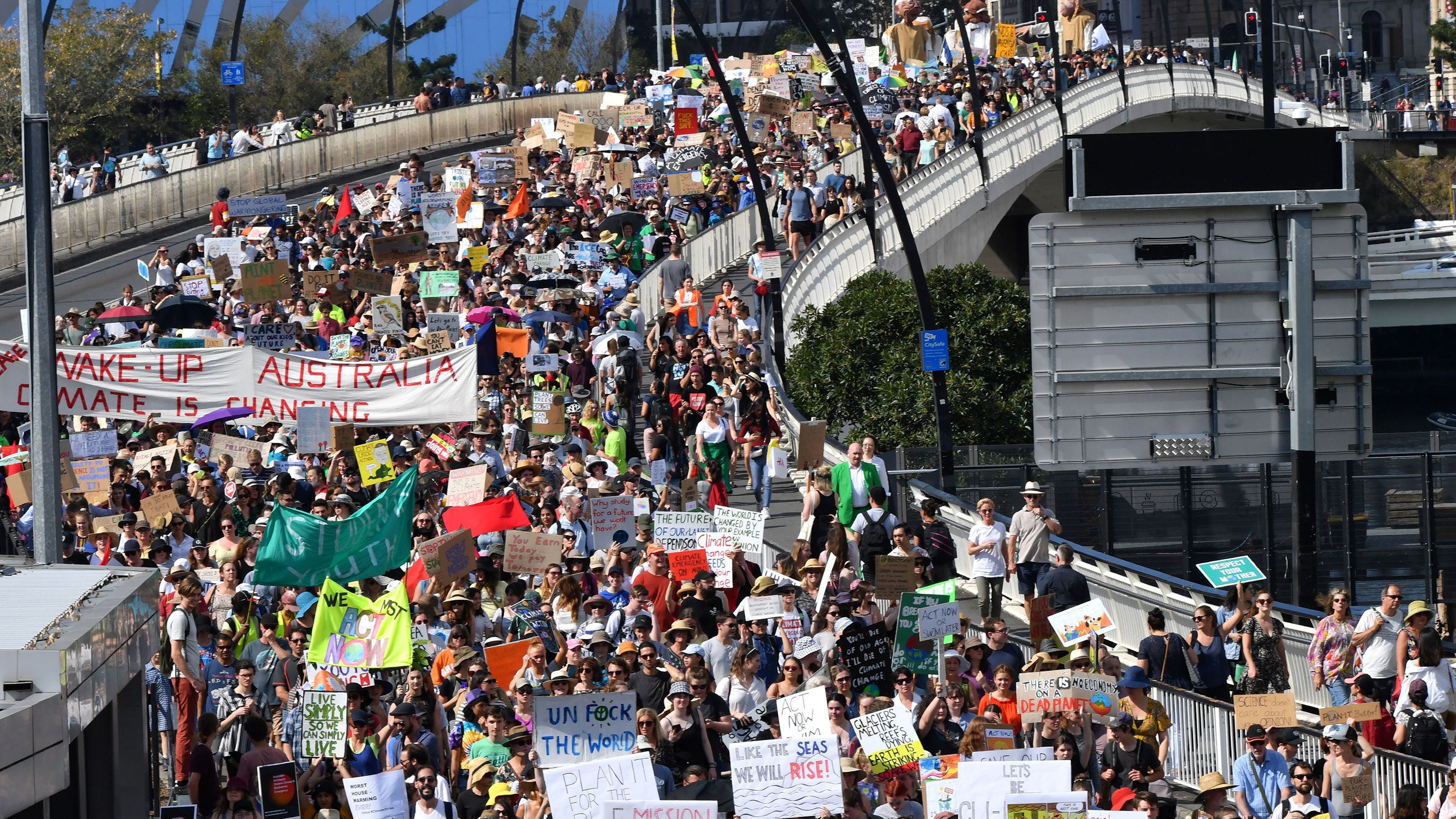 Climate change protesters cross the Victoria Bridge in Brisbane, Australia.