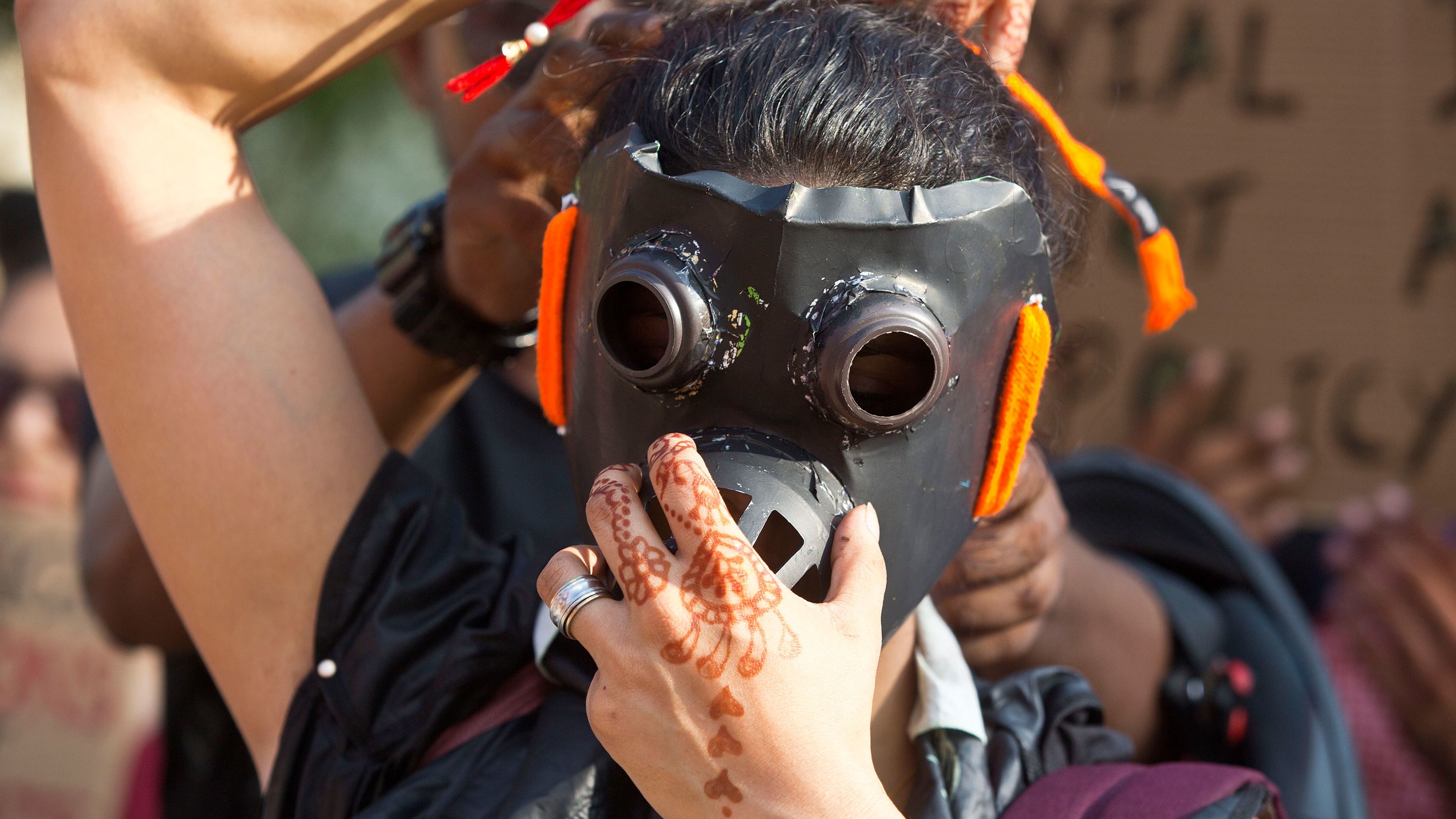 A protester wears a gas mask during a march in Gauhati, India.