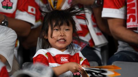 A young Japan fan cheers on the team before the Japan 2019 Rugby World Cup Pool A match between Japan and Russia.