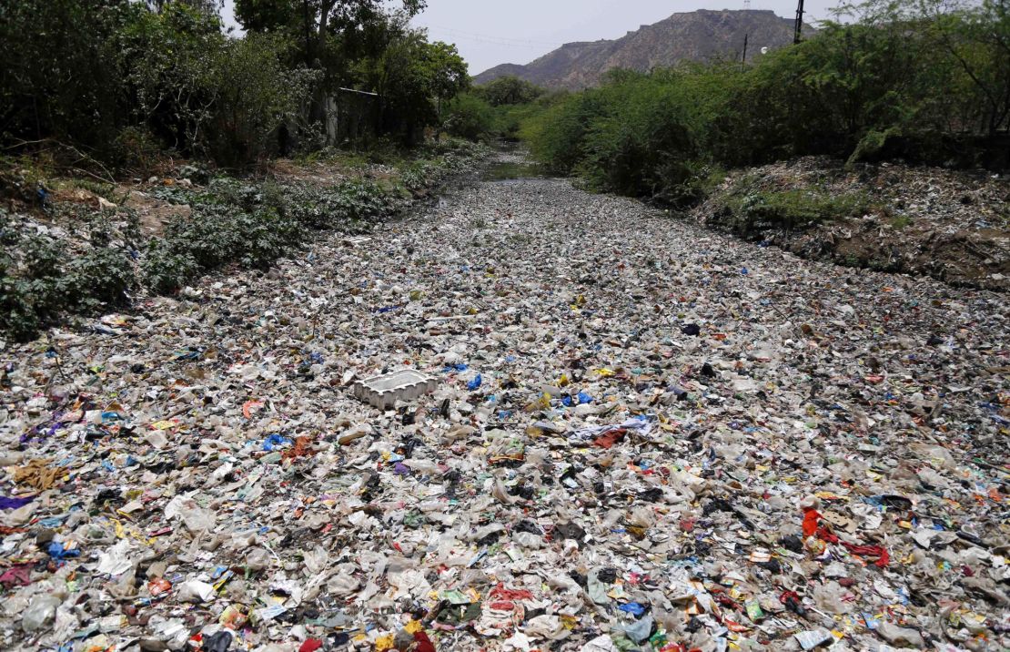 India throws out over 9 million tons of plastic per year. Here, garbage floats along a river in Ajmer, in the Indian state of Rajasthan. 