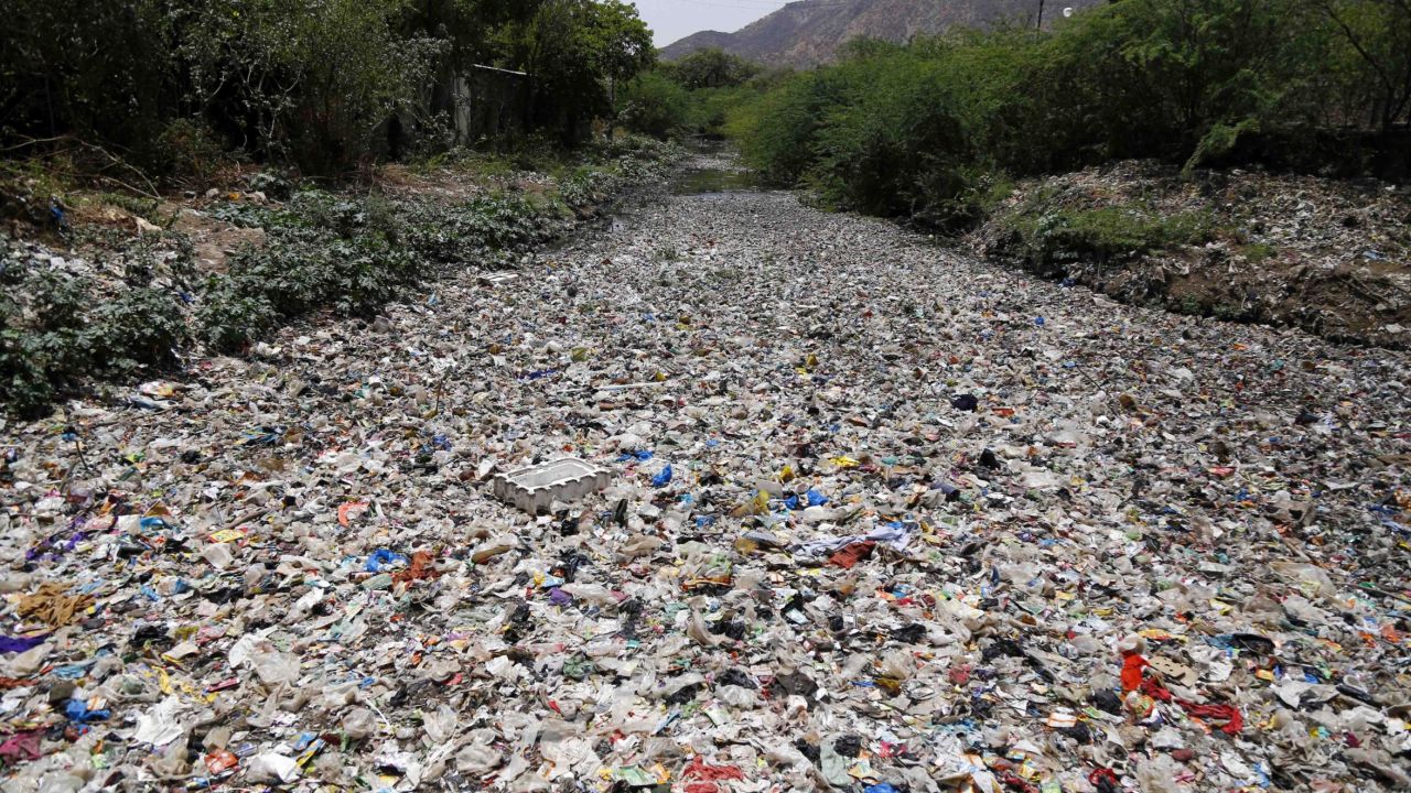 India throws out over 9 million tons of plastic per year. Here, garbage floats along a river in Ajmer, in the Indian state of Rajasthan.