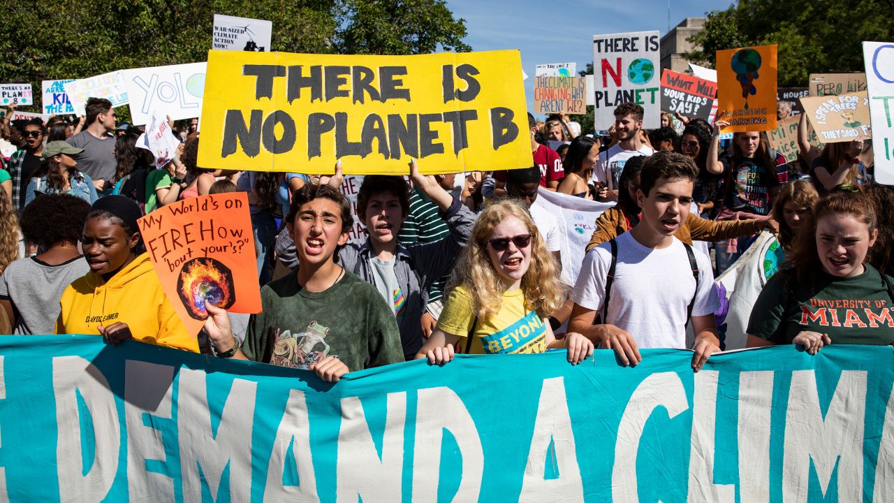 Activists in Washington, D.C., gather in John Marshall Park for a march Friday.